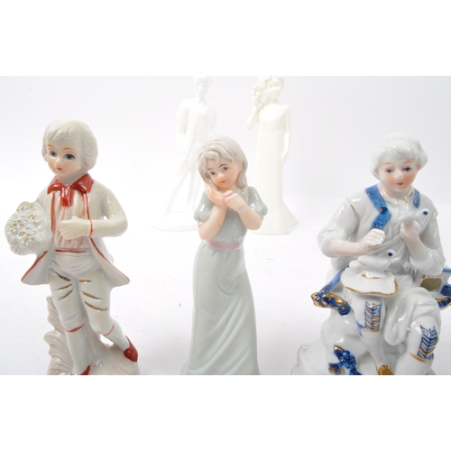 111 - A collection of 20th century bone china figurines to include Royal Doulton Moments collection Gradua... 