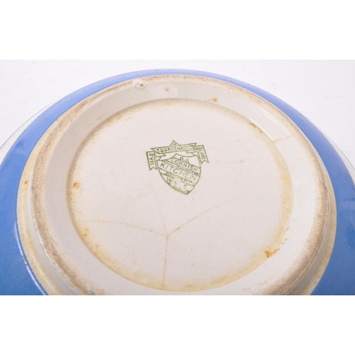 112 - T. G. Green - An early 20th century china T. G. Green Cornish ware mixing bowl with butter bowl. Mea... 