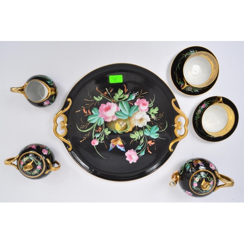 120 - A 19th century French porcelain cabaret trayed tea set for two. The cabaret set comprising of teapot... 