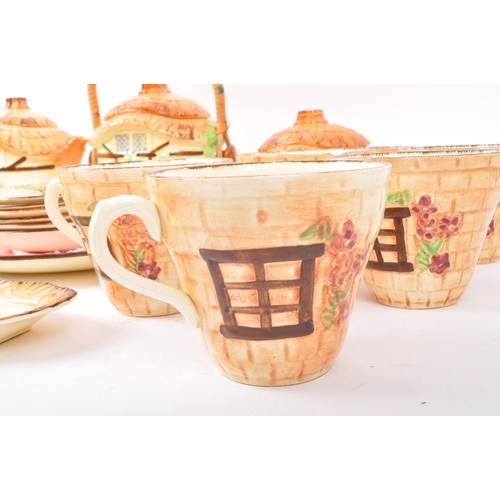 29 - A vintage 20th century Burlington Ware 'Devon Cobb' tea service comprising of teapot, ginger jar, va... 