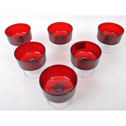 51 - A collection of vintage 20th Century French stemmed ice cream bowls / champagne glasses. In a red gr... 