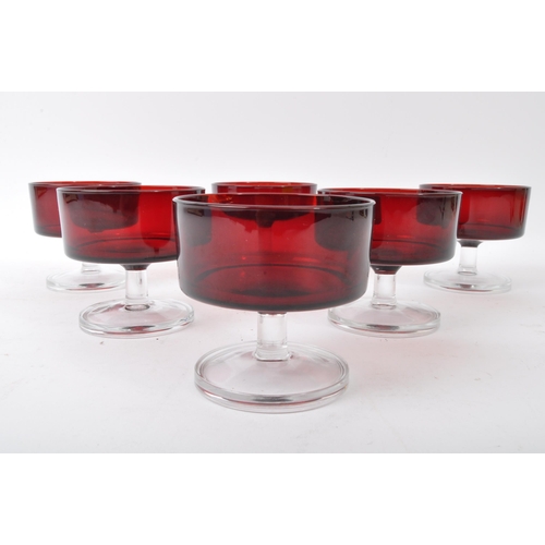 51 - A collection of vintage 20th Century French stemmed ice cream bowls / champagne glasses. In a red gr... 