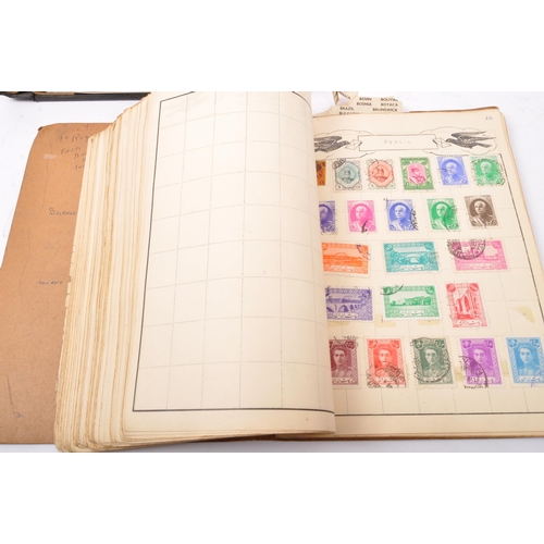 545 - A collection of early 20th century and later British and foreign postage stamps held across five pre... 