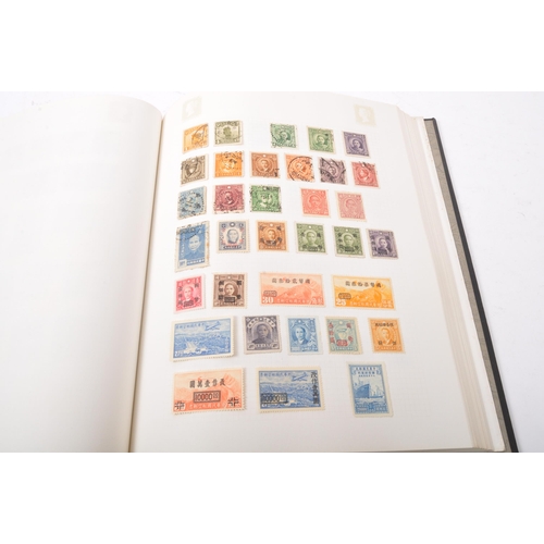 545 - A collection of early 20th century and later British and foreign postage stamps held across five pre... 