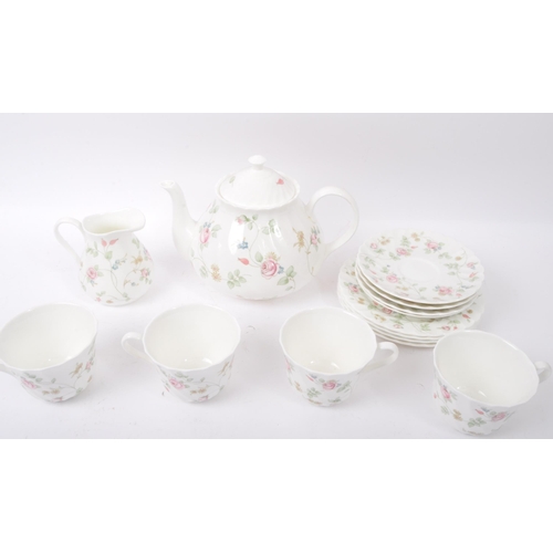 55 - A vintage 20th Century Wedgwood fine bone china English tea service set in Rosehip pattern. Comprisi... 