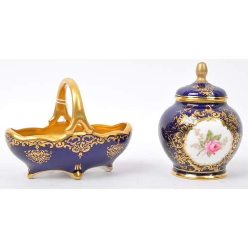 63 - Two early 20th century Coalport fine bone china cobalt & gilt items. The lot to include a sugar bowl... 