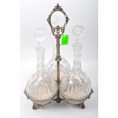 70 - A Victorian 19th century silver plated three galleried basket tantalus with three decanters of bulbo... 