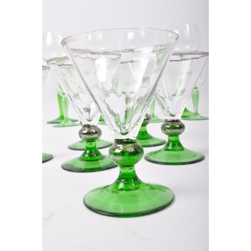 78 - An assortment of vintage retro mid 20th century emerald and clear drinking glasses to include a set ... 
