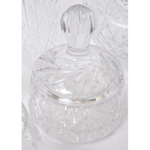 79 - A large collection of vintage 20th century cut glass items. The lot to include decanters, an oversiz... 