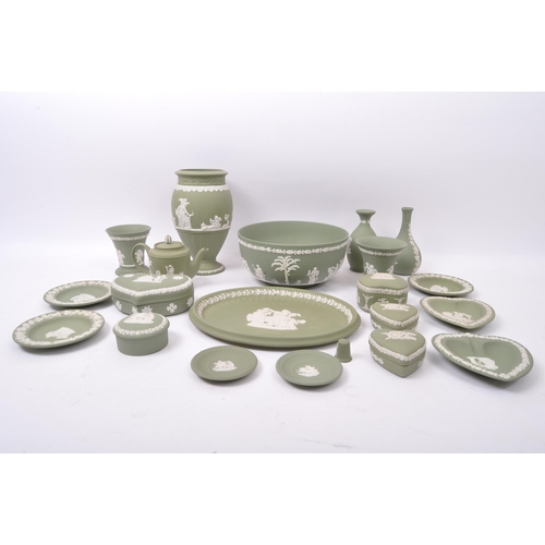 85 - A large collection vintage 20th century Wedgwood green Jasperware ceramic cameo ware. The lot to inc... 