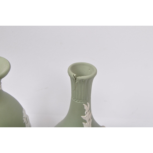 85 - A large collection vintage 20th century Wedgwood green Jasperware ceramic cameo ware. The lot to inc... 