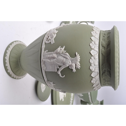 85 - A large collection vintage 20th century Wedgwood green Jasperware ceramic cameo ware. The lot to inc... 