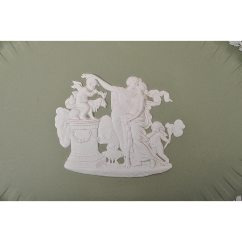 85 - A large collection vintage 20th century Wedgwood green Jasperware ceramic cameo ware. The lot to inc... 