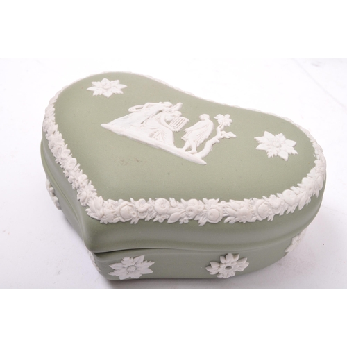 85 - A large collection vintage 20th century Wedgwood green Jasperware ceramic cameo ware. The lot to inc... 