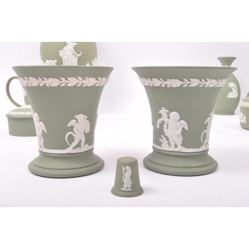 85 - A large collection vintage 20th century Wedgwood green Jasperware ceramic cameo ware. The lot to inc... 