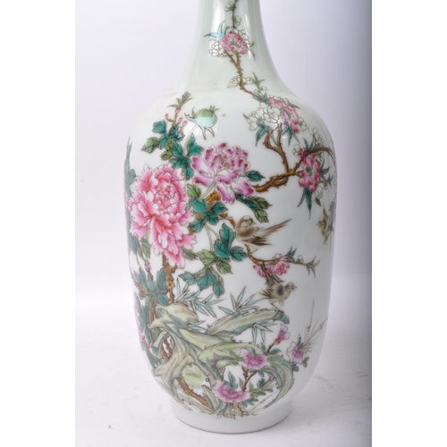 9 - A 20th century Chinese Oriental Famille Rose porcelain tall vase having a celadon ground decorated w... 