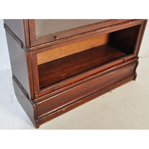 1006 - An original early 20th Century Globe Wernicke stacking modular barrister / lawyers bookcase having s... 