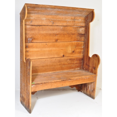 1010 - A 19th Century Victorian pine tavern settle bench pew. Having a canopy top over a panelled back flan... 