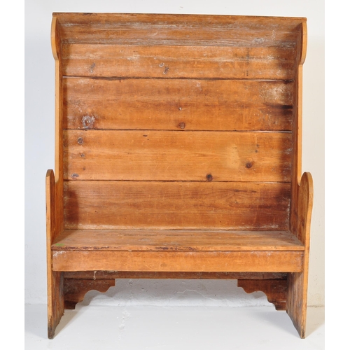 1010 - A 19th Century Victorian pine tavern settle bench pew. Having a canopy top over a panelled back flan... 