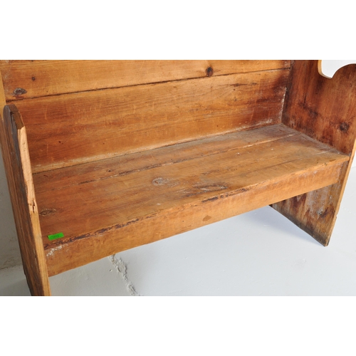 1010 - A 19th Century Victorian pine tavern settle bench pew. Having a canopy top over a panelled back flan... 