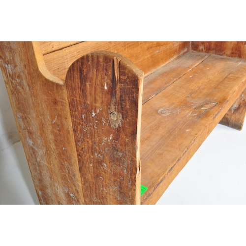 1010 - A 19th Century Victorian pine tavern settle bench pew. Having a canopy top over a panelled back flan... 