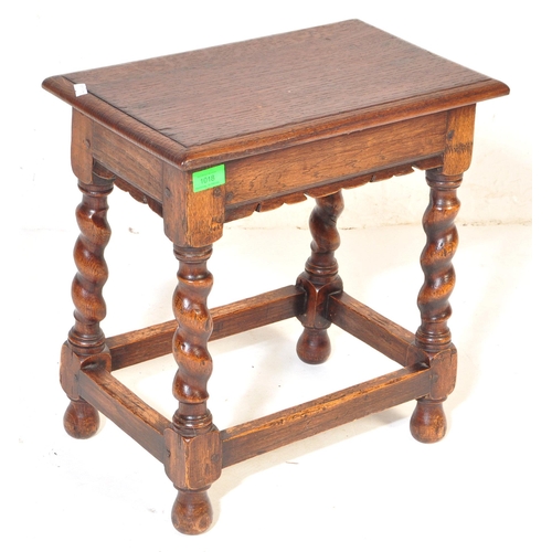 1018 - Jacobean revival peg jointed oak stool. Raised on barley  twist legs with bell feet united by square... 