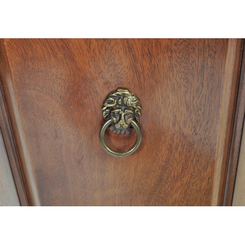 1019 - A Regency revival mahogany and gilt tooled leather  octagonal drum cabinet. Raised on sabre legs wit... 