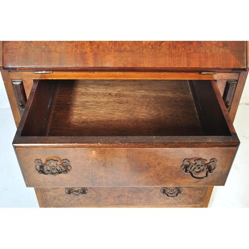 1020 - Queen Anne revival walnut ladies writing bureau desk. Raised on a plinth base with upright bank of d... 