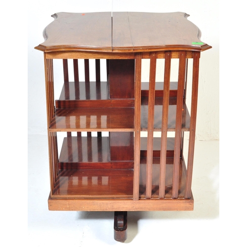 1022 - A Victorian 19th century mahogany revolving library bookcase. Raised on a four point base with uprig... 
