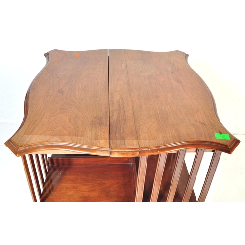 1022 - A Victorian 19th century mahogany revolving library bookcase. Raised on a four point base with uprig... 