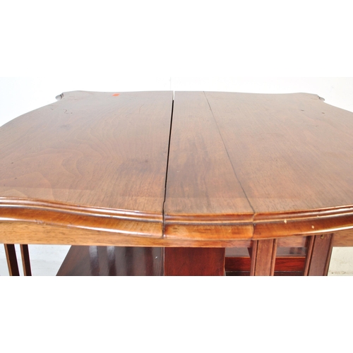 1022 - A Victorian 19th century mahogany revolving library bookcase. Raised on a four point base with uprig... 