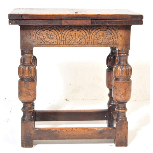 1023 - Jacobean revival peg jointed oak stool - draw leaf side table. Raised on cup and cover legs with squ... 