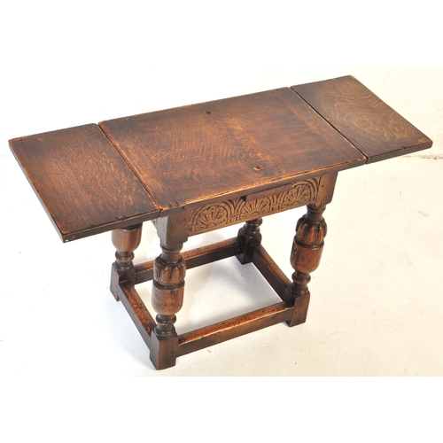 1023 - Jacobean revival peg jointed oak stool - draw leaf side table. Raised on cup and cover legs with squ... 