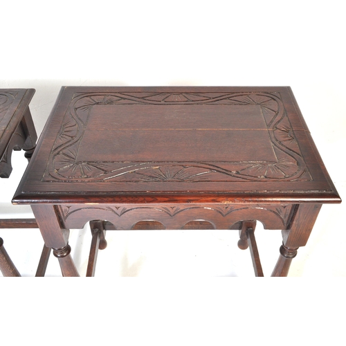1026 - A pair of 20th century Jacobean Revival circa 1920soak side occasional tables, each with carved deco... 