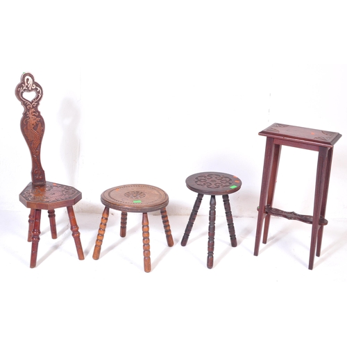 1027 - An assortment of early 20th century and later oak furniture pieces to include a carved Welsh spinnin... 