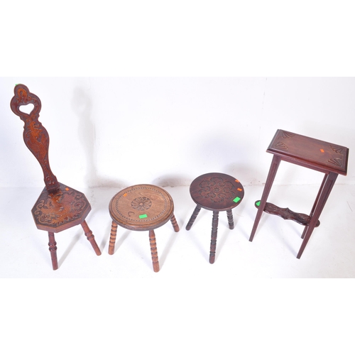 1027 - An assortment of early 20th century and later oak furniture pieces to include a carved Welsh spinnin... 