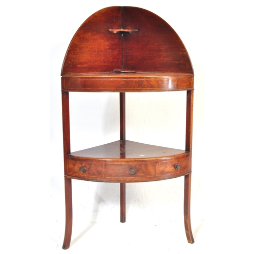 1029 - A 19th century George III mahogany washstand. Tapering legs with lower triangular frieze having draw... 