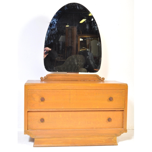 1033 - A vintage 20th Century Art Deco oak dressing chest of drawers with shaped mirror. Rectangular form w... 