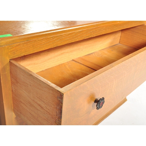 1033 - A vintage 20th Century Art Deco oak dressing chest of drawers with shaped mirror. Rectangular form w... 