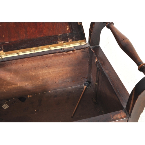 1035 - An early 20th Century Edwardian piano stool. Of rectangular form with brown upholstered fabric cushi... 