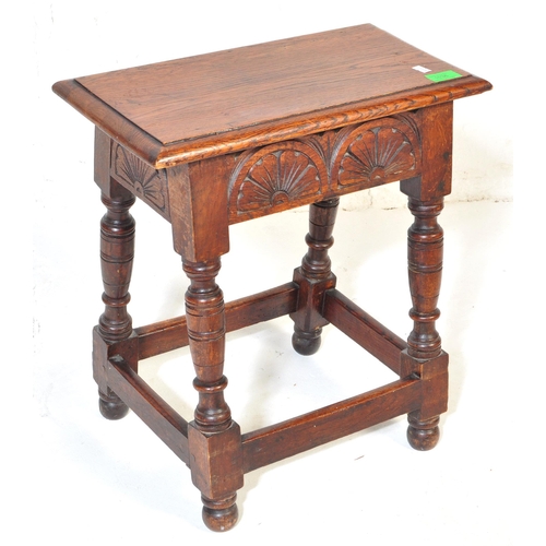 1036 - Jacobean revival peg jointed oak stool. Raised on cup and cover legs with bun feet united by square ... 