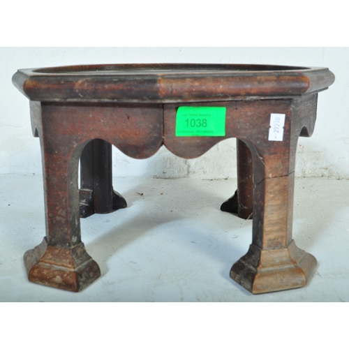 1038 - A Victorian 19th Century Arts & Craft table top plant stand. Of circular mahogany construction with ... 