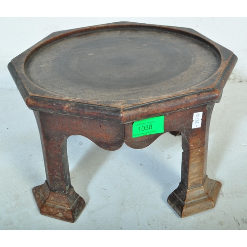1038 - A Victorian 19th Century Arts & Craft table top plant stand. Of circular mahogany construction with ... 