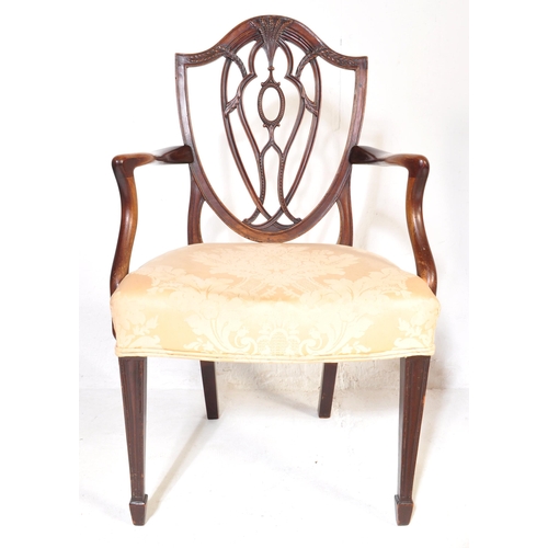 1039 - An early 20th Century Edwardian satin wood marquetry inlaid dining hall chair. Having a harebell swa... 