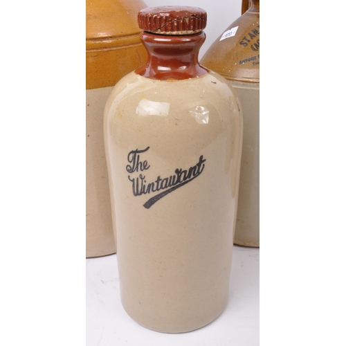 551 - A collection of six vintage 20th Century stoneware flagons / water jugs. Three with two tone affect ... 