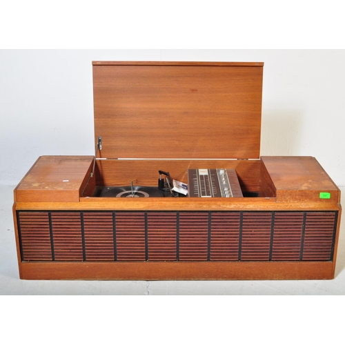 553 - A vintage retro mid 20th century teak stereogram with lift up top. Legs AF but present. Measures app... 