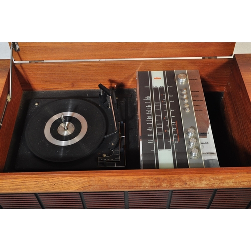 553 - A vintage retro mid 20th century teak stereogram with lift up top. Legs AF but present. Measures app... 