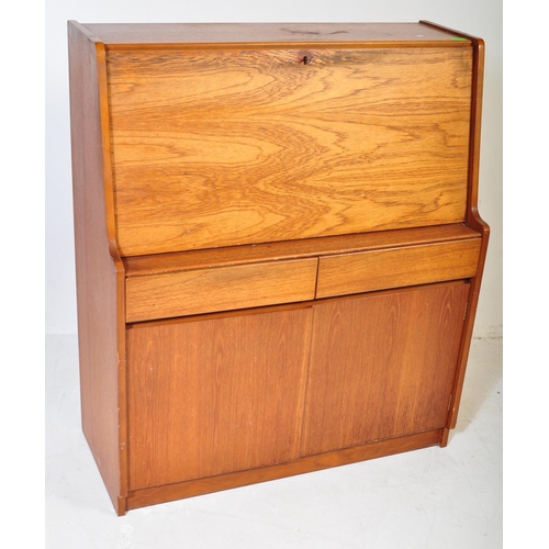 554 - A retro mid 20th century circa. 1960's teak bureau having a fall front cupboard door over fully appo... 