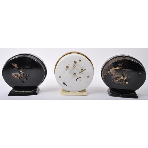 555 - A collection of three vintage mid 20th century clocks to include a Superbell accompanied by two West... 