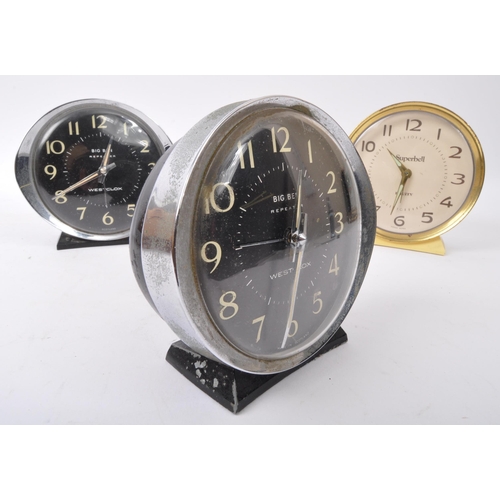 555 - A collection of three vintage mid 20th century clocks to include a Superbell accompanied by two West... 